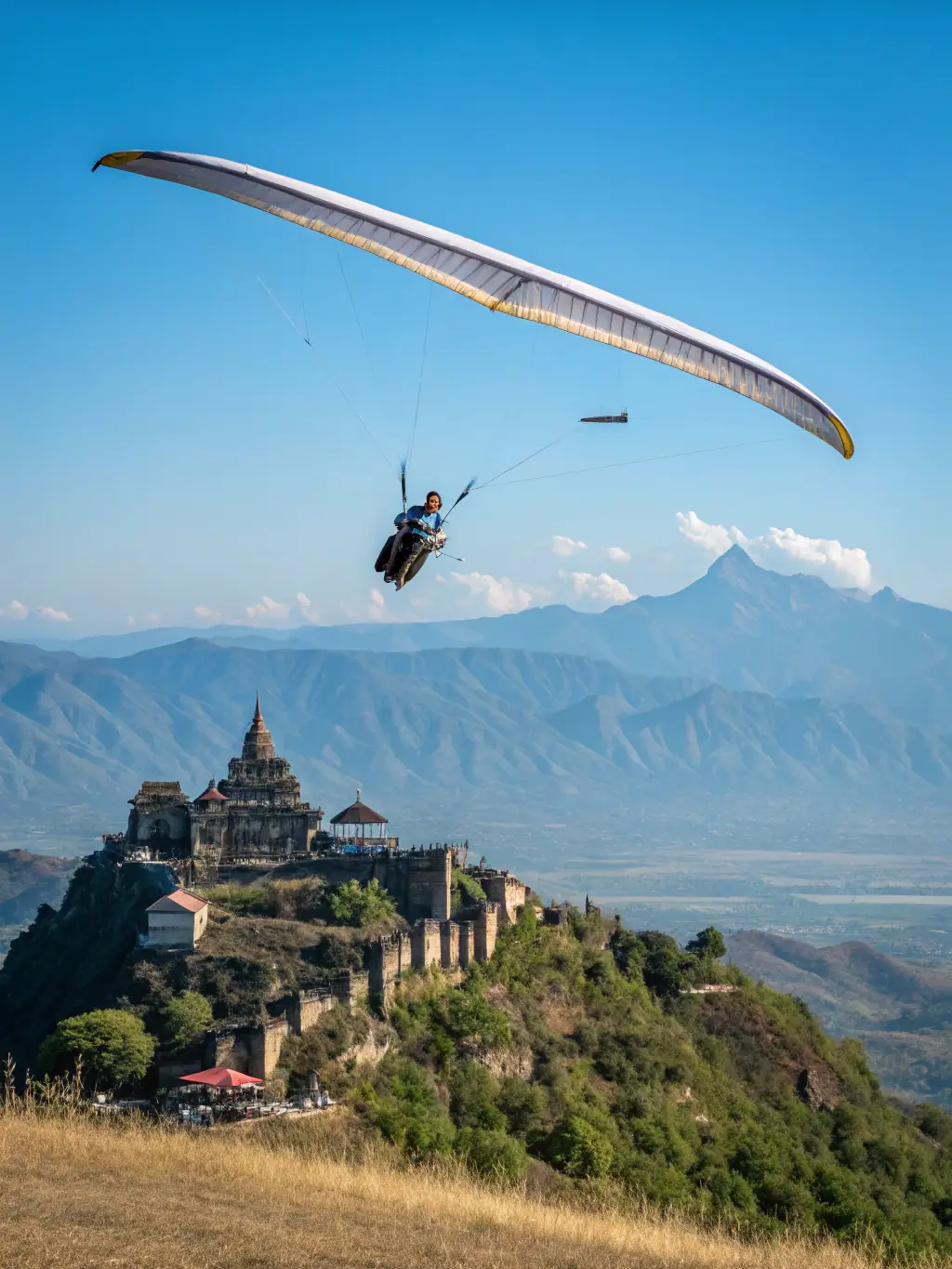 A pilot preparing for takeoff with stunning mountain scenery in the background, emphasizing the unique access to recreational aviation that the organization provides, to highlight access to recreational aviation.